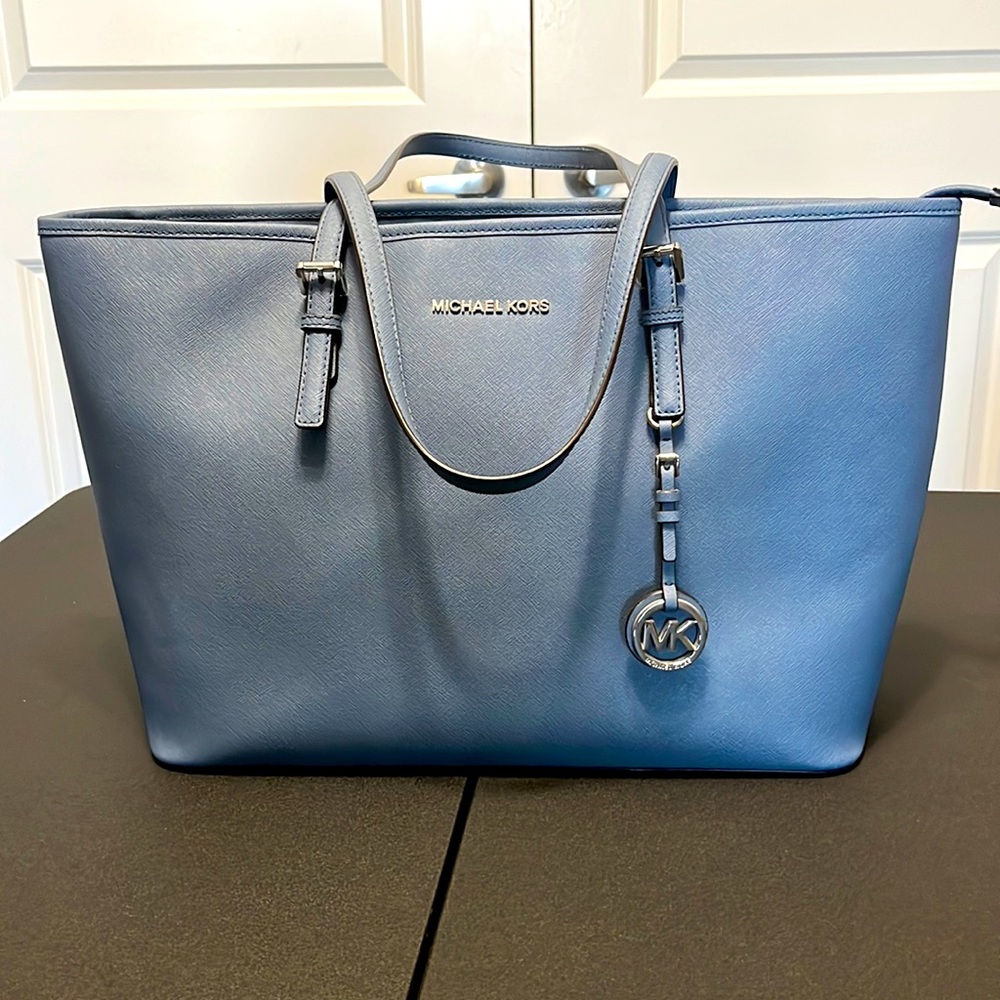 Michael Kors blue/grey leather bag with tons of pockets inside. Like new.
